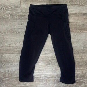 Lululemon athletica size 4 black crop leggings side zip pocket tulip hem capri